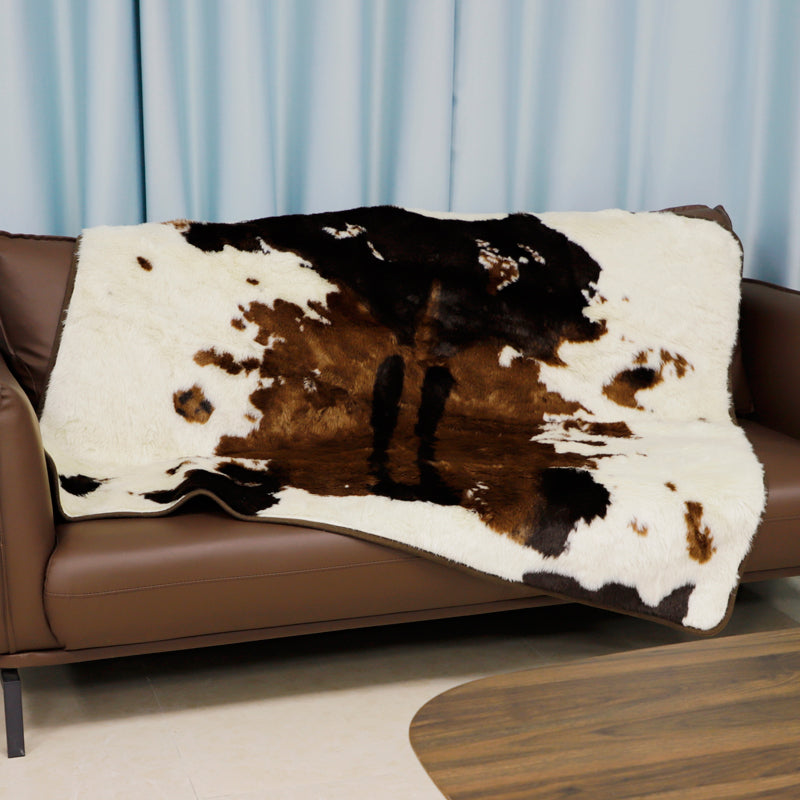Irregular patches of waterproof faux fur throw blanket