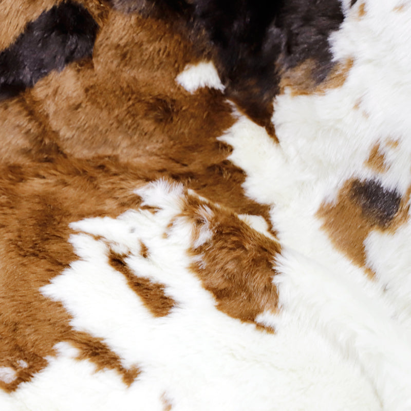 Irregular patches of waterproof faux fur throw blanket