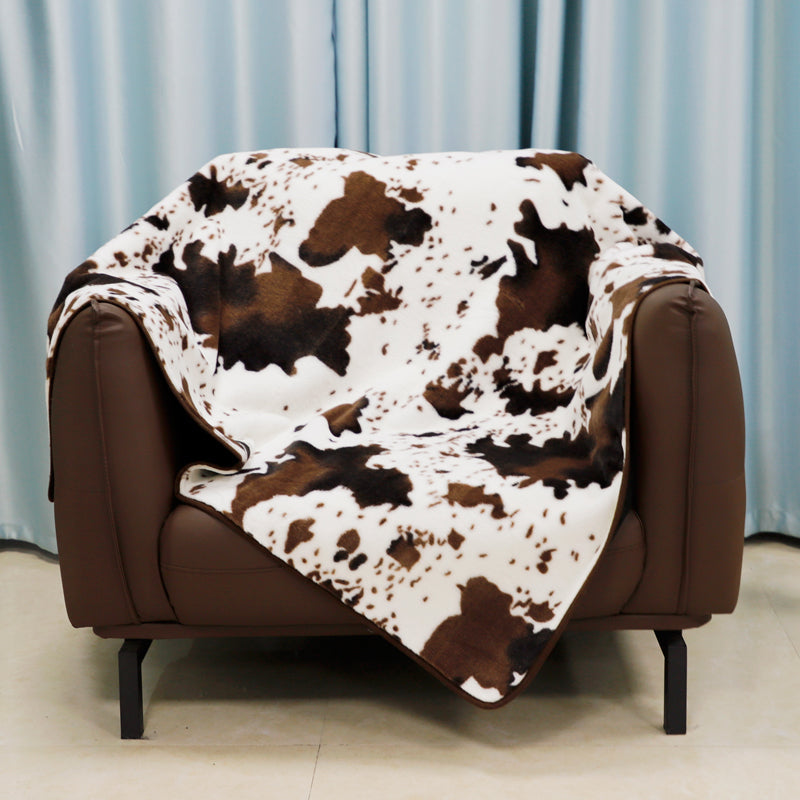Irregular patches of waterproof faux fur throw blanket