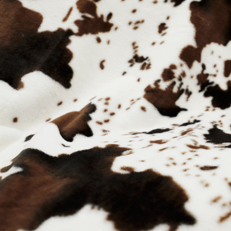 Irregular patches of waterproof faux fur throw blanket