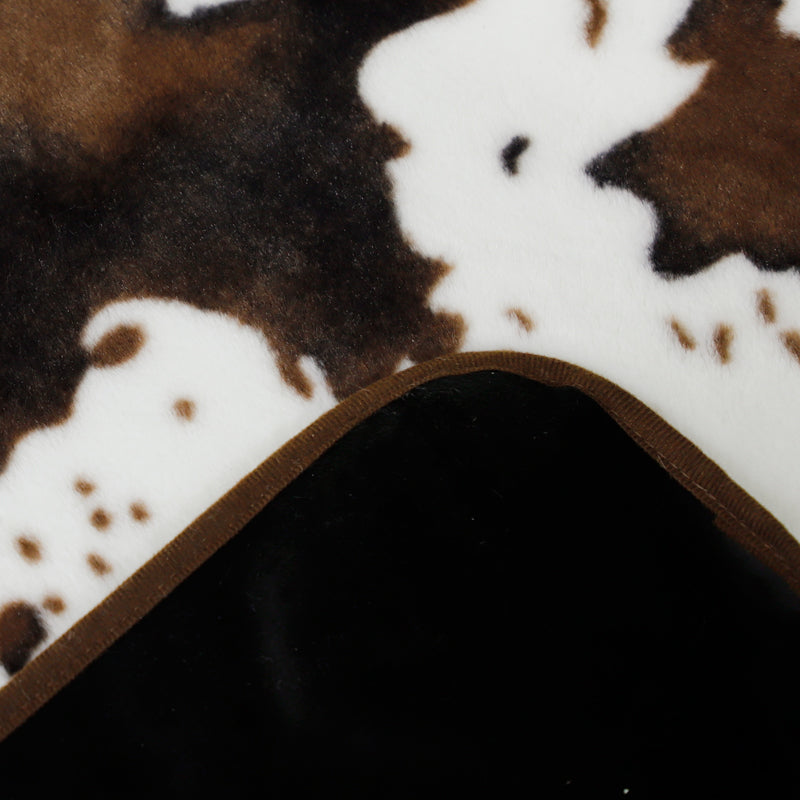 Irregular patches of waterproof faux fur throw blanket