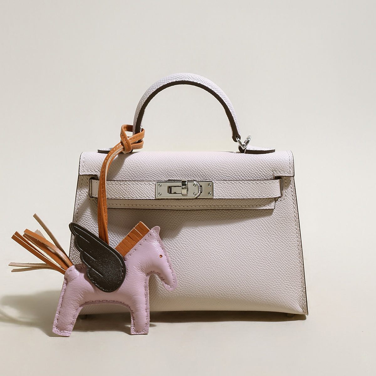 Trendy Petite Top Handle Bag with a Horse Charm